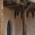 Natural eucalyptus wood pergola with a covering of date palm-fronds.