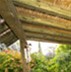 Processed pine pergola, painted green and combined with a bamboo ceiling and Ipea deck