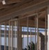 Combined visible wooden roof with metal and brick wall (window frames)